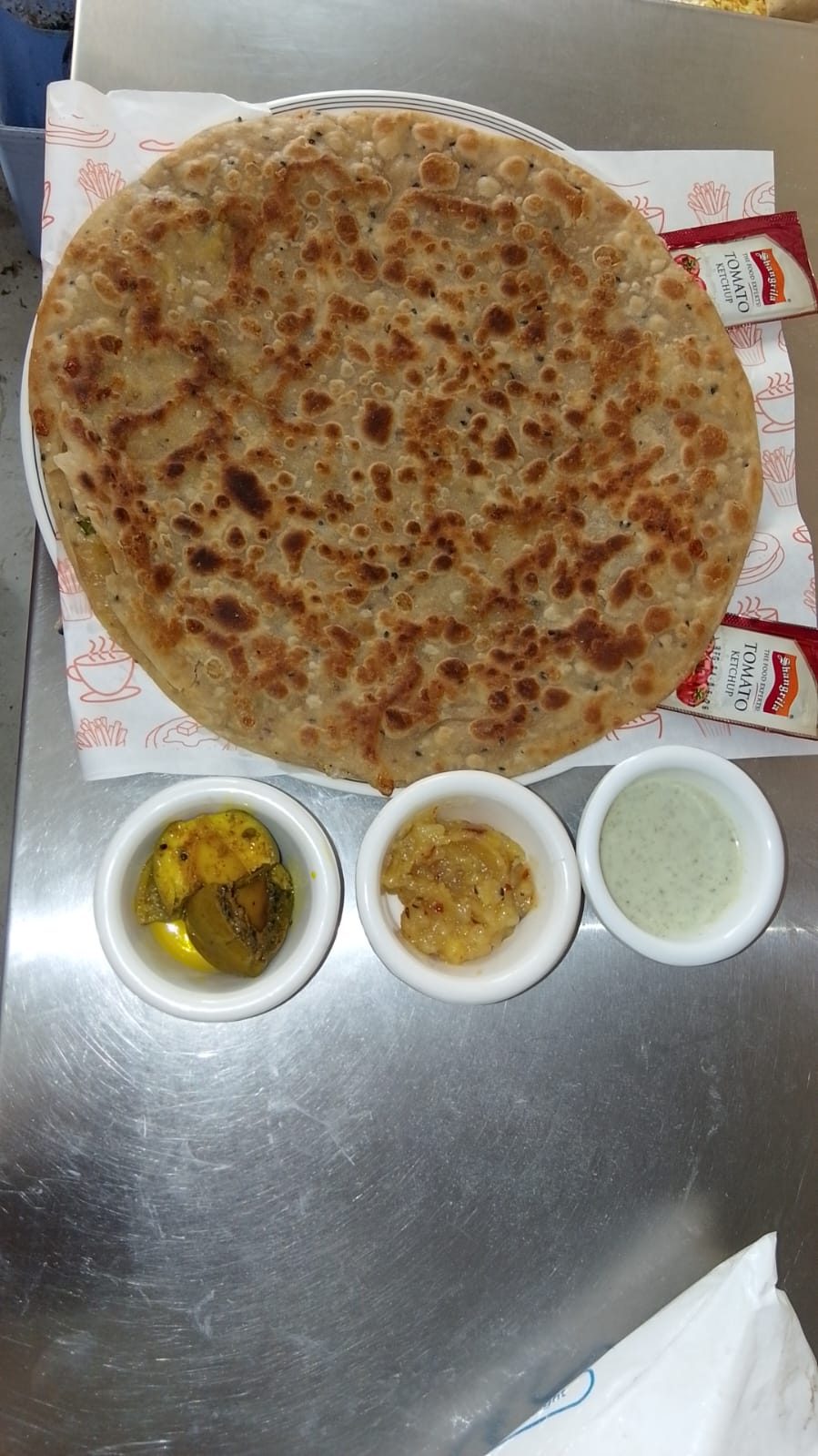 Cheese paratha pulled apart showing a melted, stretchy centre