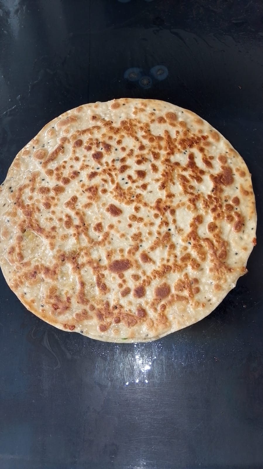 Fully cooked paratha with a crisp, deep-golden crust